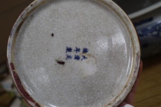 A Chinese blue and white large tripod censer, a peach bloom brush washer and a famille verte vase